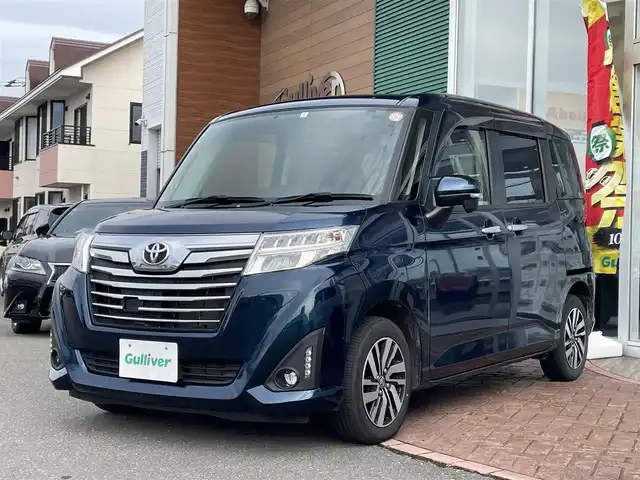 トヨタ ルーミー カスタムG 道央・札幌 2017(平29)年 10.3万km レーザーブルークリスタルシャイン ４WD/ワンオーナー/純正SDナビ(AM/FM/CD/SD/BT)/ワンセグ(走行中視聴不可)/バックカメラ/アイドリングストップ/ウィンカーミラー/ドアバイザー/プッシュスタート/両側パワースライドドア/ビルトインETC/横滑り防止装置/盗難防止装置/オートライト/フォグランプ/革巻きステアリング/ステアリングスイッチ/後席ロールサンシェード/純正エンジンスターター/スペアキー×１