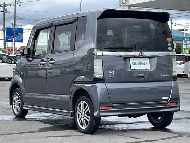 ホンダ Ｎ ＢＯＸ カスタム G Aパッケージ 道北・旭川 2015(平27)年 8.1万km ポリッシュドメタルメタリック 4WD/純正メモリナビ/ CD/DVD/SD/1セグ/バックカメラ/CTBA/左パワースライドドア /横滑り防止/オートライト/HIDヘッドライト/フォグライト/プッシュスタート /ミラーヒーター /純正フロアマット/ドアバイザー