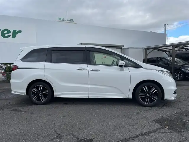 ホンダ オデッセイ アブソルート 福島県 2015(平27)年 8.7万km ホワイトオーキッドパール ４ＷＤ/純正ナビ/フルセグＴＶ/ＣＤ/ＤＶＤ/ＦＭ・ＡＭ/Ｂｌｕｅｔｏｏｔｈ/バックカメラ/片側パワスラ/レーンアシスト/衝突軽減ブレーキ/クルーズコントロール/社外センターコンソール/ＥＴＣ/純正フロアマット/ハーフレザーシート