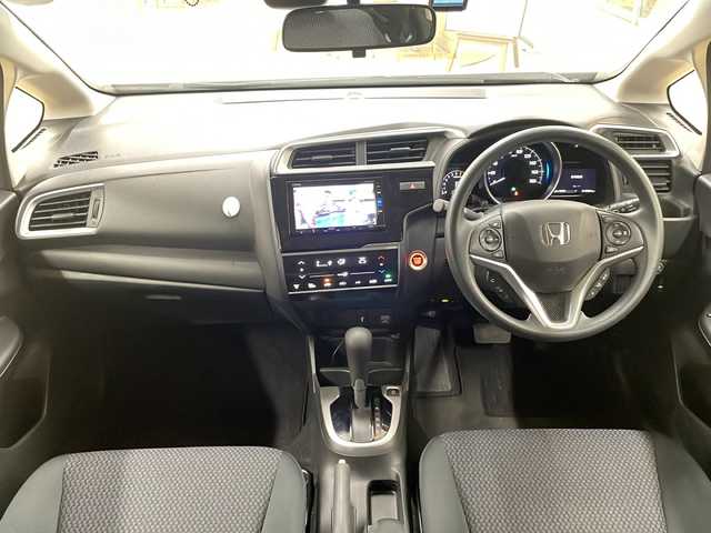 ホンダ フィット 13G L ホンダセンシング 道央・札幌 2019(令1)年 1.9万km ルージュアメジストM ・4WD/・純正ナビ/フルセグTV/DVD/CD/SD/BT/・バックカメラ/・ドライブレコーダー/・ホンダセンシング/・CMBS/・アダプティブクルーズコントロール/・先行車発進お知らせ/・路外逸脱抑制システム/・レーンキープアシスト/・標識認識機能/・アイドリングストップ/・横滑り防止/・ワイパーデアイサー/・ビルトインETC/・LEDヘッドライト/・LEDフォグ/・プッシュスタート/・スマートキー/・ドアバイザー/・電格ミラー/・ミラーヒーター/・夏タイヤ純正15インチAW積込