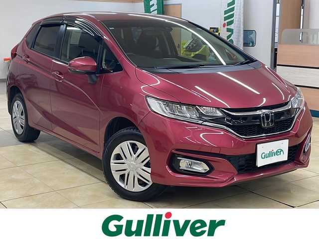 ホンダ フィット 13G L ホンダセンシング 道央・札幌 2019(令1)年 1.9万km ルージュアメジストM ・4WD/・純正ナビ/フルセグTV/DVD/CD/SD/BT/・バックカメラ/・ドライブレコーダー/・ホンダセンシング/・CMBS/・アダプティブクルーズコントロール/・先行車発進お知らせ/・路外逸脱抑制システム/・レーンキープアシスト/・標識認識機能/・アイドリングストップ/・横滑り防止/・ワイパーデアイサー/・ビルトインETC/・LEDヘッドライト/・LEDフォグ/・プッシュスタート/・スマートキー/・ドアバイザー/・電格ミラー/・ミラーヒーター/・夏タイヤ純正15インチAW積込