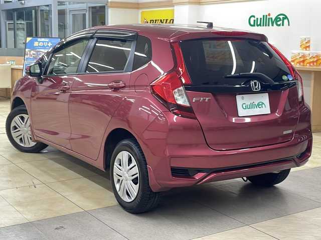 ホンダ フィット 13G L ホンダセンシング 道央・札幌 2019(令1)年 1.9万km ルージュアメジストM ・4WD/・純正ナビ/フルセグTV/DVD/CD/SD/BT/・バックカメラ/・ドライブレコーダー/・ホンダセンシング/・CMBS/・アダプティブクルーズコントロール/・先行車発進お知らせ/・路外逸脱抑制システム/・レーンキープアシスト/・標識認識機能/・アイドリングストップ/・横滑り防止/・ワイパーデアイサー/・ビルトインETC/・LEDヘッドライト/・LEDフォグ/・プッシュスタート/・スマートキー/・ドアバイザー/・電格ミラー/・ミラーヒーター/・夏タイヤ純正15インチAW積込