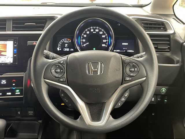 ホンダ フィット 13G L ホンダセンシング 道央・札幌 2019(令1)年 1.9万km ルージュアメジストM ・4WD/・純正ナビ/フルセグTV/DVD/CD/SD/BT/・バックカメラ/・ドライブレコーダー/・ホンダセンシング/・CMBS/・アダプティブクルーズコントロール/・先行車発進お知らせ/・路外逸脱抑制システム/・レーンキープアシスト/・標識認識機能/・アイドリングストップ/・横滑り防止/・ワイパーデアイサー/・ビルトインETC/・LEDヘッドライト/・LEDフォグ/・プッシュスタート/・スマートキー/・ドアバイザー/・電格ミラー/・ミラーヒーター/・夏タイヤ純正15インチAW積込