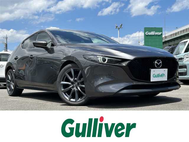 マツダ マツダ３ファストバック 20S プロアクティブ ツーリングS 愛知県 2020(令2)年 6.7万km マシーングレープレミアムM メーカーナビ（AM/FM/フルセグ/BT/CD/DVD）/ETC/全方位カメラ/i-ACTIVSENSE/・スマートブレーキサポート/・車線逸脱警報システム/・ブラインドスポットモニター/・レーンキープアシスト/・道路標識警報/・パーキングセンサー/レーダークルーズコントロール/ヘッドアップディスプレイ/D席パワーシート/D席シートメモリー/純正前後ドライブレコーダー/ハンドルヒーター/MTモード付AT/革巻きステアリング/電格ミラー/純正アルミホイール/LEDヘッドライト/前後コーナーセンサー/スマートキー/スペアキー