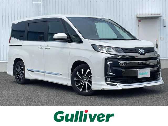 トヨタ ノア ハイブリッド S－Z 熊本県 2023(令5)年 1.2万km ホワイトパールクリスタルシャイン ワンオーナー車/保証書・取説有り/純正ディスプレイオーディオ/・CD/DVD/BT/フルセグ/ミラキャスト/ＨＤMI/バックカメラ/フリップダウンモニター/ETC2.0/両側パワースライドドア/LEDライト/ハーフレザーシート/モデリスタフルエアロ/トヨタセーフティセンス/・AHB/・LDA/・PDA/・PKSB/・RSA/電子パーキング/マット/スマートキー/スペアキー×1