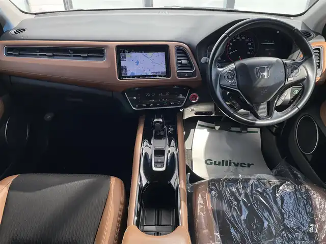 ホンダ ヴェゼル ハイブリッド Z ホンダセンシング 大阪府 2018(平30)年 4.1万km プラチナホワイトパール ワンオーナー　/純正８インチナビ　/   フルセグＴＶ/CD/DVD/Bluetooth/USB　/バックモニター　/衝突軽減ブレーキ　/前席シートヒーター　/レーダークルーズコントロール/レーンキープアシスト　/アイドリングストップ　/ハーフレザーシート/純正17インチアルミホイール　/スマートキー　/ビルトインＥＴＣ　/ＬＥＤライト