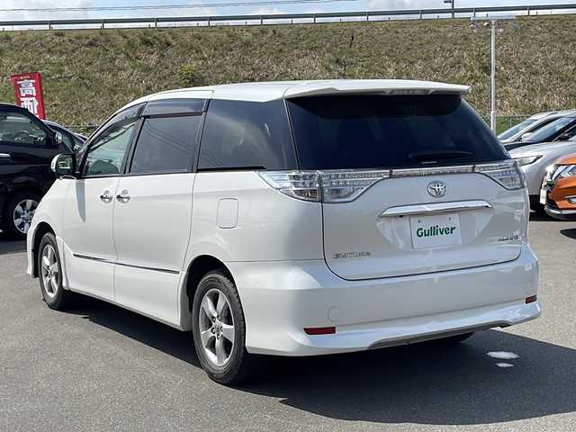 トヨタ エスティマ アエラス プレミアムエディション 青森県 2016(平28)年 3.7万km ホワイトパールクリスタルシャイン ・4WD/・純正ナビ（NSZA-X64T）/・フルセグ/・CD/DVD/SD/Bluetooth/・バックカメラ/・プッシュスタート/・スマートキー/・スペアキー1本/・横滑り防止/・オートライト/・MTモード付AT/・クルーズコントロール/・ビルドインETC/・パワーシート（D席）/・オットマン/・両側パワースライドドア/・純正フロアマット/・純正AW16インチ/・ドアバイザー/・冬タイヤAWセット積込み