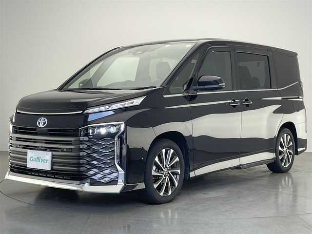 トヨタ ヴォクシー ハイブリッド S－Z 愛知県 2023(令5)年 1.8万km アティチュードブラックマイカ 純正１０型ＤＡナビ　フルセグＴＶ　Ｂｌｕｅｔｏｏｔｈ　ＨＤＭＩ　全方位カメラ　アドバンストパーク　３眼ＬＥＤヘッドライト　デジイン　パワーバックドア　ＥＴＣ２．０　純正前後ドラレコ　１，２列目シートヒーター/ユニバーサルステップ