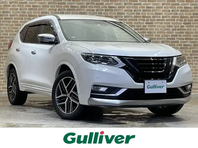 日産 エクストレイル モード・プレミア i 岩手県 2018(平30)年 2.1万km ブリリアントホワイトパール 特別仕様車/４WD/プロパイロット/本革シート/アラウンドビューモニター/MzSPEEDフロントグリル/パワーテールゲート/インテリジェントルームミラー/エマージェンシーブレーキ/ハイビームアシスト/ヒルディセントコントロール/車線逸脱防止支援/ブラインドスポットウォーニング/リヤクロストラフィックアラート/オートブレーキホールド/前後ソナー/横滑り防止装置/アイドリングストップ/シートヒーター(前席・後席左右)/純正ナビ/フルセグTV/ドライブレコーダー/ETC/LEDヘッドライト/フォグライト/純正１９インチアルミホイール