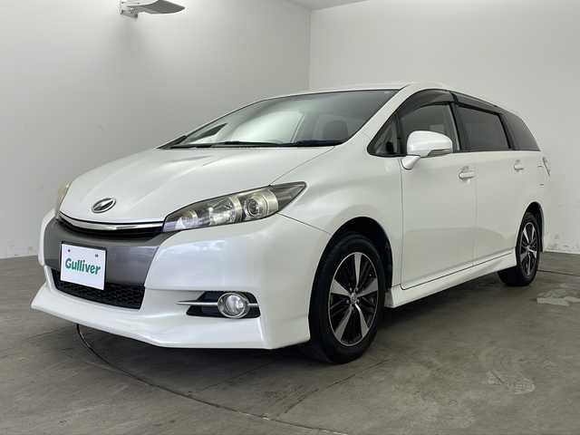 トヨタ ウィッシュ 1．8S 兵庫県 2012(平24)年 6.9万km ホワイトパールクリスタルシャイン ・純正ナビ/・CD/DVD/BT/AUX/フルセグTV/・バックカメラ/・パドルシフト/・オートエアコン/・キセノンヘッドライト/・オートライト/・フォグランプ/・ABS/・横滑り防止装置/・ビルトインETC/・オールオートパワーウィンドウ/・純正フロアマット/・純正16インチアルミホイール/・スマートキー/・プッシュスタート/・電動格納ミラー/・W＋サイドエアバッグ/・カーテンエアバッグ