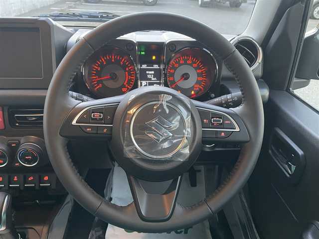 スズキ ジムニー ノマド FC 栃木県 2025(令7)年 0.1千km ＤグリーンⅡ ワンオーナー/SUZUKI Safety Support/・デュアルカメラブレーキサポート/・誤発進抑制機能/・後退時ブレーキサポート/・後方誤発進抑制機能/・車線逸脱警告機能/・ふらつき警報機能/・ハイビームアシスト/・先行車発進お知らせ機能/・アダプティブクルーズコントロール/ヒルホールドコントロール/ヒルディセントコントロール/シートヒーター/LEDヘッドランプ/15インチアルミホイール/ジャングルグリーン2(WA7)