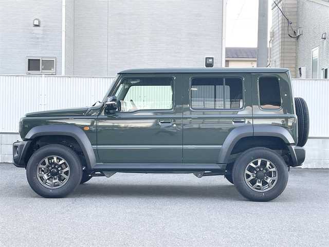 スズキ ジムニー ノマド FC 栃木県 2025(令7)年 0.1千km ＤグリーンⅡ ワンオーナー/SUZUKI Safety Support/・デュアルカメラブレーキサポート/・誤発進抑制機能/・後退時ブレーキサポート/・後方誤発進抑制機能/・車線逸脱警告機能/・ふらつき警報機能/・ハイビームアシスト/・先行車発進お知らせ機能/・アダプティブクルーズコントロール/ヒルホールドコントロール/ヒルディセントコントロール/シートヒーター/LEDヘッドランプ/15インチアルミホイール/ジャングルグリーン2(WA7)