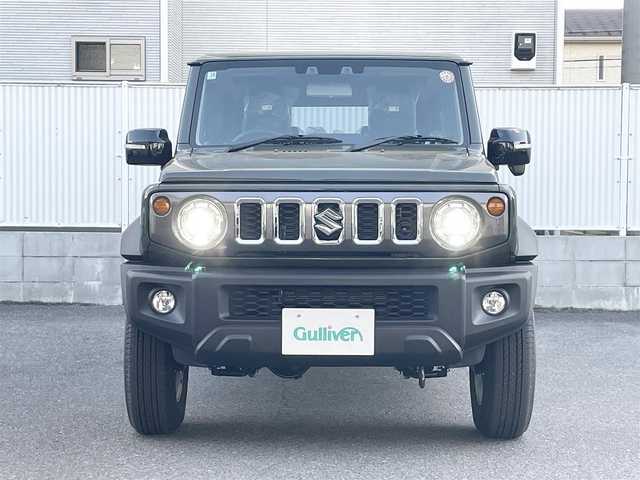 スズキ ジムニー ノマド FC 栃木県 2025(令7)年 0.1千km ＤグリーンⅡ ワンオーナー/SUZUKI Safety Support/・デュアルカメラブレーキサポート/・誤発進抑制機能/・後退時ブレーキサポート/・後方誤発進抑制機能/・車線逸脱警告機能/・ふらつき警報機能/・ハイビームアシスト/・先行車発進お知らせ機能/・アダプティブクルーズコントロール/ヒルホールドコントロール/ヒルディセントコントロール/シートヒーター/LEDヘッドランプ/15インチアルミホイール/ジャングルグリーン2(WA7)