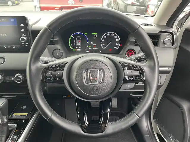 ホンダ ヴェゼル ハイブリッド e:HEV Z 滋賀県 2024(令6)年 1.6万km プラチナホワイトパール 純正9インチメモリナビ/【Bluetooth/USB/Apple Car Play/Android Auto/フルセグ 】/バックカメラ/ハーフレザー/シートヒーター/追従クルーズコントロール/前後ソナー/ホンダセンシング/パワーリアゲート/オートハイビーム/ステアリングヒーター/レーンキープアシスト/オートホールド/LEDヘッドライト/ビルトインETC2.0/純正18アルミ