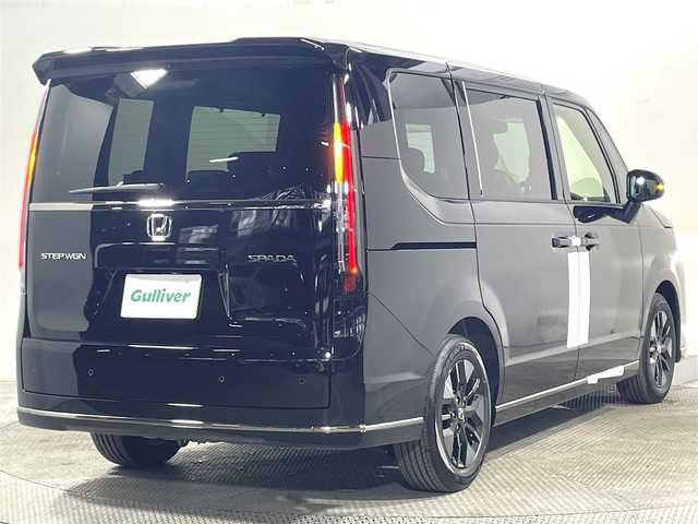 ホンダ ステップワゴン スパーダ 大阪府 2025(令7)年 0.1万km未満 クリスタルブラックパール 登録済未使用車 純正11.4incナビ(フルセグ/DVD再生/Bluetooth) バックカメラ 後席モニター ハーフレザー シートヒーター オットマン 電動リアゲート 衝突軽減 レーダーC BSM