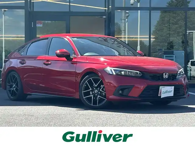 ホンダ シビック EX 栃木県 2021(令3)年 1.7万km プレミアムクリスタルレッドM ワンオーナー/ホンダセンシング/純正ナビ/フルセグTV/DVD/Bluetooth/USB/AppleCarPlay/バックカメラ/ビルトインETC2.0/ダウンサス/社外マフラー（純正サス積込)/ハーフレザーシート/パワーシート/シートヒーター/TVキャンセラー/ワイヤレス充電/フットイルミネーション/ブラインドスポットモニター/アダプティブクルーズコントロール/コーナーセンサー/スマートキー/プッシュスタート