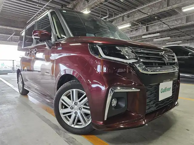 スズキ ソリオ HV MZ 宮崎県 2021(令3)年 7万km メロウディープレッドパール ワンオーナー/純正MOP9型ナビ/フルセグTV/両側パワースライドドア/全方位モニター/ビルトインETC/ドライブレコーダー/アダプティブクルーズコントロール/セーフティサポート/・衝突被害軽減ブレーキ/・後退時ブレーキサポート/・車線逸脱警報/・前後誤発進抑制/・ハイビームアシスト/・標識認識/・リアパーキングセンサー/LEDヘッドランプ/革巻きステアリング/ハンズフリーステアリングスイッチ/純正15インチアルミホイール/スマートキー/プッシュエンジンスタート/禁煙車