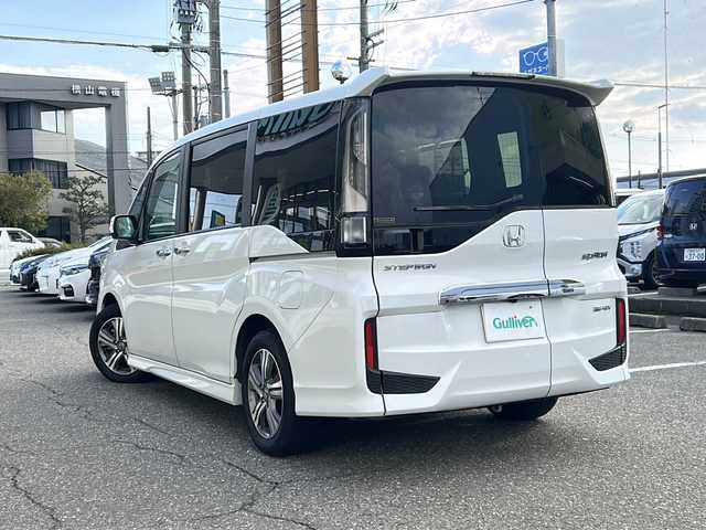 ホンダ ステップワゴン スパーダ eHEV G EXホンダS 福井県 2022(令4)年 5.9万km プラチナホワイトパール ナビ装着スペシャルパッケージ/＋ETC2.0車載機（ナビ連動）/ホンダセンシング/ターボ/純正10インチメモリナビゲーション/（CD/DVD/BT）/フルセグテレビ/バックカメラ/アダプティブクルーズコントロール/レーンキープアシスト/わくわくゲート/LEDヘッドライト/LEDフォグランプ/ドライブレコーダー（前後）/ハーフレザーシート/純正16インチアルミホイール/両側電動スライドドア/前席シートヒーター/3列シート/ウォークスルー/ステアリングリモコン/オートリトラミラー/オートライト/スマートキー/プッシュスタート/保証書/取扱説明書