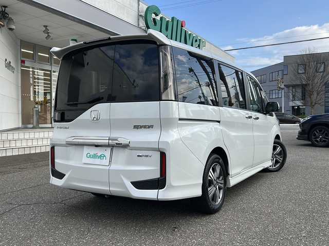 ホンダ ステップワゴン スパーダ eHEV G EXホンダS 福井県 2022(令4)年 5.9万km プラチナホワイトパール ナビ装着スペシャルパッケージ/＋ETC2.0車載機（ナビ連動）/ホンダセンシング/ターボ/純正10インチメモリナビゲーション/（CD/DVD/BT）/フルセグテレビ/バックカメラ/アダプティブクルーズコントロール/レーンキープアシスト/わくわくゲート/LEDヘッドライト/LEDフォグランプ/ドライブレコーダー（前後）/ハーフレザーシート/純正16インチアルミホイール/両側電動スライドドア/前席シートヒーター/3列シート/ウォークスルー/ステアリングリモコン/オートリトラミラー/オートライト/スマートキー/プッシュスタート/保証書/取扱説明書