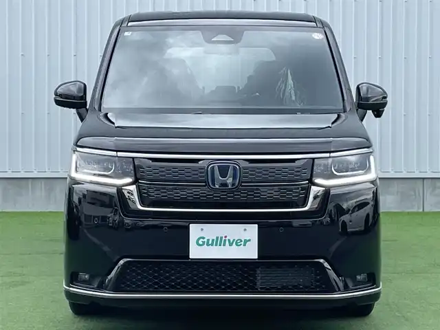 ホンダ ステップワゴン スパーダ eHEV 香川県 2025(令7)年 0.1千km クリスタルブラックパール 登録時走行距離：６ｋｍ/登録済未使用車/ホンダセンシング　/純正ナビゲーション/→フルセグ　/→ＣＤ／ＤＶＤ　/レーダークルーズコントロール/ブラインドスポットモニター/ステアリングリモコン/革巻きステアリング　　/シートヒーター　/両側パワースライド　/フリップダウンモニター　/オットマン　/ＬＥＤオートライト　/フォグランプ/前後コーナーセンサー/スマートキー/スペアキー
