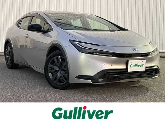 トヨタ プリウス X 滋賀県 2024(令6)年 0.7万km シルバーメタリック 社外ディスプレイオーディオ/・Bluetooth/USB/バックカメラ/革巻きステアリング/ステアリングリモコン/レーダークルコン/AC100V/トヨタセーフティセンス/・プロアクティブドライビングアシスト/・プリクラッシュセーフティー/・レーンディパーチャーアラート/・リヤクロストラフィックアラート/・ロードサインアシスト/・ブラインドスポットモニター/・クリアランスソナー/・安心降車アシスト/LEDヘッドライト/スペアキー