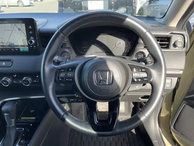 ホンダ ヴェゼル ハイブリッド e:HEV Z 滋賀県 2023(令5)年 1.2万km サンドカーキパール 純正9インチナビ/【Bluetooth/フルセグTV/USB】/バックカメラ/追従クルーズコントロール/クリアランスソナー/LEDヘッドライト/オートマチックハイビーム/ブラインドスポットインフォメーション/衝突被害軽減ブレーキ/レーンキープアシスト/前後ドライブレコーダー/D/Nシートヒーター/ワイヤレス充電/電動パーキングブレーキ/オートブレーキホールド/ビルトインETC2.0/パドルシフト/純正フロアマット/プッシュスタート/スマートキー/ステアリングリモコン