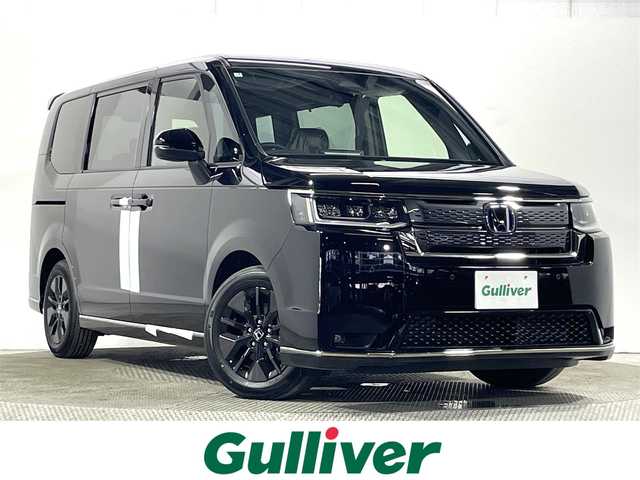 ホンダ ステップワゴン スパーダ eHEV 大阪府 2025(令7)年 0.1万km未満 クリスタルブラックパール 登録済未使用車 純正ナビ(フルセグ/DVD再生/Bluetooth) バックカメラ 後席モニター ハーフレザー シートヒーター 電動リアゲート 衝突軽減 レーダーC BSM クリアランスソナー