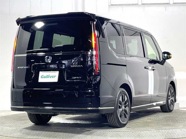 ホンダ ステップワゴン スパーダ eHEV 大阪府 2025(令7)年 0.1万km未満 クリスタルブラックパール 登録済未使用車 純正ナビ(フルセグ/DVD再生/Bluetooth) バックカメラ 後席モニター ハーフレザー シートヒーター 電動リアゲート 衝突軽減 レーダーC BSM クリアランスソナー
