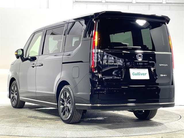 ホンダ ステップワゴン スパーダ eHEV 大阪府 2025(令7)年 0.1万km未満 クリスタルブラックパール 登録済未使用車 純正ナビ(フルセグ/DVD再生/Bluetooth) バックカメラ 後席モニター ハーフレザー シートヒーター 電動リアゲート 衝突軽減 レーダーC BSM クリアランスソナー