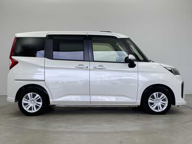 トヨタ ルーミー G 新潟県 2023(令5)年 2万km パールホワイトⅢ 純正ディスプレイオーディオ/全方位カメラ/スマートアシスト/　・衝突軽減ブレーキ/　・先行車発信お知らせ/　・車線逸脱警報/　・標識認識/　・ふらつき警報/前後ドライブレコーダー/ビルトインETC/両側パワースライドドア/コーナーセンサー/オートライト/オートハイビーム/LEDヘッドライト/アイドリングストップ/プッシュスタート/前席シートヒーター/オートドアミラー/純正フロアマット/純正ドアバイザー/スペアキー×1