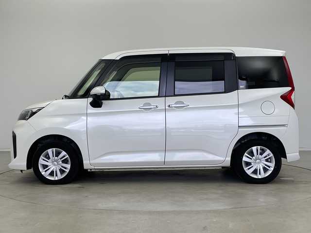 トヨタ ルーミー G 新潟県 2023(令5)年 2万km パールホワイトⅢ 純正ディスプレイオーディオ/全方位カメラ/スマートアシスト/　・衝突軽減ブレーキ/　・先行車発信お知らせ/　・車線逸脱警報/　・標識認識/　・ふらつき警報/前後ドライブレコーダー/ビルトインETC/両側パワースライドドア/コーナーセンサー/オートライト/オートハイビーム/LEDヘッドライト/アイドリングストップ/プッシュスタート/前席シートヒーター/オートドアミラー/純正フロアマット/純正ドアバイザー/スペアキー×1