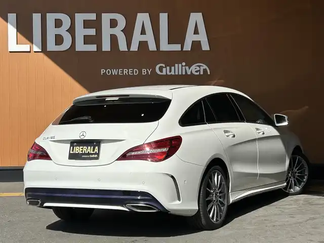 メルセデス・ベンツ ＣＬＡ１８０ Sブレイク AMG スタイル 高知県 2017(平29)年 2.6万km カルサイトホワイト AMGプレミアムパッケージ/　・レザーDINAMICAシート/　・本革巻きステアリング/　・ステンレスアクセル＆ブレーキペダル/　・アンビエントライト/　・パノラマスライディングルーフ/　・harman/kardon/　・メモリー付きフルパワーシート/　・Mercedes-Benzロゴ付きブレーキキャリパー/レーダーセーフティパッケージ/純正ナビ/バックカメラ/ハーフレザーシート