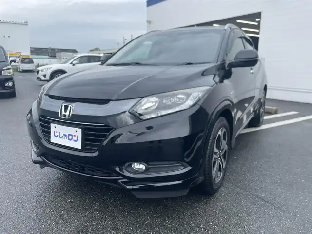 ホンダ ヴェゼル ハイブリッド Z 熊本県 2014(平26)年 10.8万km クリスタルブラックパール (株)IDOMが運営する【じしゃロン熊本店】の自社ローン専用車両になります。こちらは現金またはオートローンご利用時の価格です。自社ローンご希望の方は別途その旨お申付け下さい　/社外ナビ/バックカメラ/フルセグテレビ/DVD/CD/Bluetooth接続/ETC/ハーフレザーシート/シートヒーター/クルーズコントロール/LEDヘッドライト/オートライト/スマートキー/純正アルミホイール