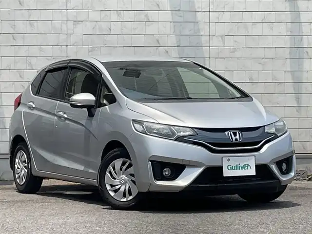 ホンダ フィット 13G Fパッケージ 大分県 2014(平26)年 12.6万km アラバスターシルバーメタリック ワンオーナー/純正メモリナビ VXM-145VSi/【ワンセグ/CD/BTオーディオ】/バックカメラ/フォグランプ/ヘッドライトレベライザー/ステアリングリモコン/チルトステアリング/運転席シートリフター/横滑り防止装置/エンジンプッシュスタート/アイドリングストップ/ウインカーミラー/リアプライバシーガラス/ドアバイザー/フロアマット/電動格納ミラー/Wエアバッグ/ABS/スマートキー×2/保証書/車両取説