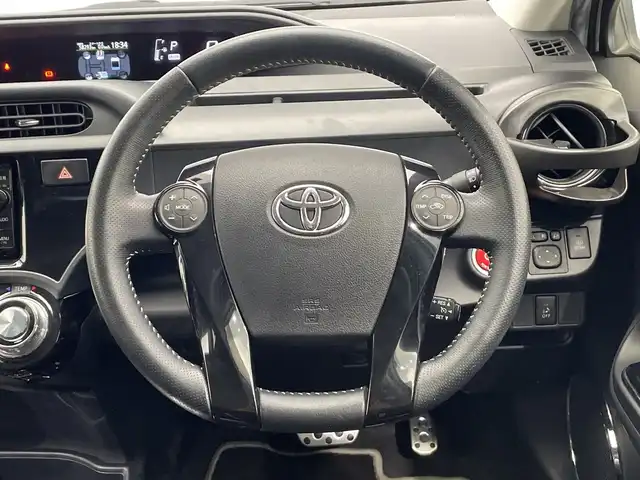 トヨタ アクア G G’s 栃木県 2015(平27)年 5.9万km ライムホワイトパールクリスタルシャイン 純正ナビ/(Bluetooth/CD/DVD/フルセグTV/MSV/SD)/ミラー型ドラレコ/バックカメラ/ETC/ハーフレザーシート/オートライト/LEDヘッドライト/横滑り防止装置/フォグランプ/スマートキー/プッシュスタート/アイドリングストップ/ステアリングスイッチ/ウィンカーミラー/電動格納ミラー/純正17インチアルミホイール/純正フロアマット/デイライト/ドアバイザー