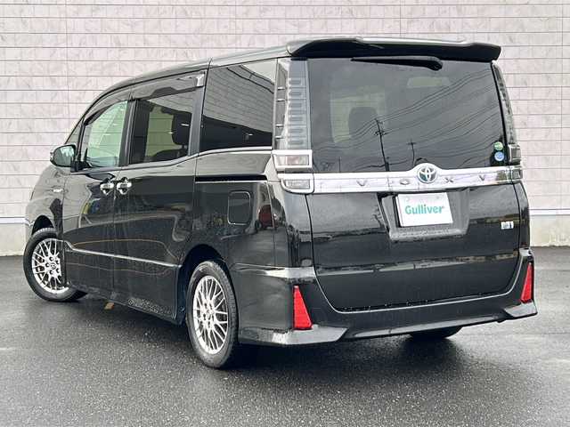 トヨタ ヴォクシー ハイブリッド ZS 煌 茨城県 2018(平30)年 9.6万km イナズマスパーキングブラックガラスフレーク ALPINEナビ（X9Z）/【フルセグTV/CD/DVD/Bluetooth】/バックカメラ/ALPINE12.8インチフリップダウンモニター/両側パワースライドドア/プリクラッシュセーフティ/レーンディパーチャーアラート/クルーズコントロール/横滑り防止装置/ドライブレコーダー/前席シートヒーター/純正16インチAW/ETC/オートハイビーム/オートライト/フォグランプ/純正フロアマット/純正ドアバイザー/ISOFIX