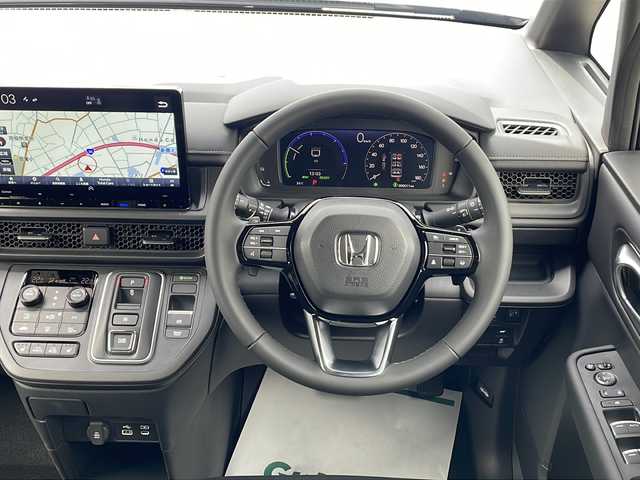 ホンダ ステップワゴン スパーダ eHEV 三重県 2025(令7)年 0.1千km クリスタルブラックパール 登録済未使用車/純正11.4型ナビ(AM/FM/CD/DVD/TV/BT)/純正15.6型リア席モニター/バックカメラ/BSM/前席シートヒーター/電動リヤゲート/スペアキー/オットマン/USB・タイプC給電ポート/革巻きステアリング/コーナーセンサー/レーダークルーズコントロール/パドルシフト/ウォークスルー/オートハイビーム/両側パワースライドドア/デイライト/電動格納ミラー/禁煙車