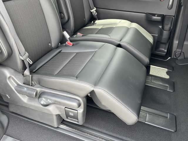 ホンダ ステップワゴン スパーダ eHEV 三重県 2025(令7)年 0.1千km クリスタルブラックパール 登録済未使用車/純正11.4型ナビ(AM/FM/CD/DVD/TV/BT)/純正15.6型リア席モニター/バックカメラ/BSM/前席シートヒーター/電動リヤゲート/スペアキー/オットマン/USB・タイプC給電ポート/革巻きステアリング/コーナーセンサー/レーダークルーズコントロール/パドルシフト/ウォークスルー/オートハイビーム/両側パワースライドドア/デイライト/電動格納ミラー/禁煙車