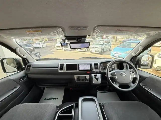 トヨタ ハイエース GL 香川県 2024(令6)年 0.4万km ホワイトパールクリスタルシャイン キャンピングカー/ストラーダSDナビ/フルセグ/CD/DVD/BT/デジタルインナーミラー/パノラミックビューモニター/セーフティセンス/プリクラッシュ/レーンキープ/オートハイビーム/シンク/ベットキット/サブバッテリー/外部１００Ｖ充電装置/電装配電盤/走行充電装置/100Vコンセント/照明/テーブル/カーテン/ＥＴＣ