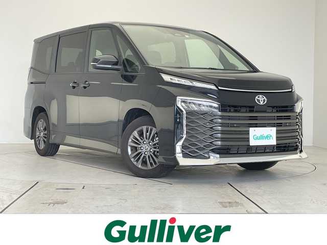 トヨタ ヴォクシー S－G 愛知県 2022(令4)年 0.8万km アティチュードブラックマイカ 純正ディズプレイオーディオ　ナビ機能なし/両側パワースライドドア/レーダークルーズコントロール/シートヒーター/バックカメラ/コーナーセンサー/純正アルミホイール/LEDヘッドライト/リアオートエアコン/オートマチックハイビーム/ETC/衝突軽減システム/Bluetooth/ステアリングスイッチ/スマートキー/プッシュスタート