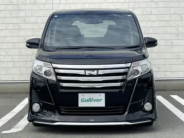 トヨタ ノア Si 福岡県 2015(平27)年 4.5万km ブラック 純正９型SDナビ(フルセグTV/CD/DVD/BT)バックカメラフリップダウンモニター両側パワスラドラレコETC純正LED純正アルミホイールプッシュスタートスマートキー