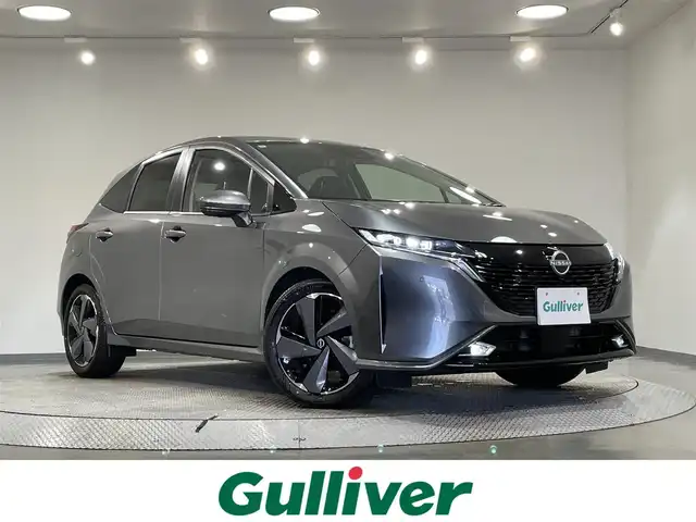 日産 オーラ G 愛知県 2024(令6)年 0.7万km ダークメタルグレー 純正９インチナビ/ＢＯＳＥサウンドシステム/プロパイロット/衝突軽減ブレーキ/ブラインドスポットモニター/クリアランスソナー/車線逸脱警報/ハーフレザーシート/ワイヤレス充電/デジタルインナーミラー/ドライブレコーダー/ビルトインＥＴＣ２．０/USB＆HDMI入力端子/アクセサリーソケット/LEDヘッドライト/ISOFIX/純正フロアマット/純正17インチアルミホイール