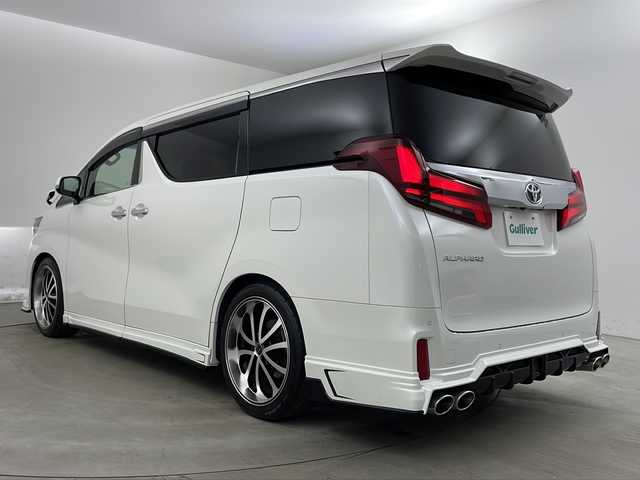 トヨタ アルファード S 兵庫県 2020(令2)年 3.3万km ホワイトパールクリスタルシャイン ・純正9インチナビ/・CD/DVD/AM/FM/・フルセグTV/・Bluetooth接続/・12.1インチフリップダウンモニター/・サンルーフ/・バックカメラ/・両側パワースライドドア/・ビルトインETC/・社外前後ドライブレコーダー/・HDMI接続/・2列目オットマン/・ZEUS製エアロ（フロント、サイド、リア）/・ZEUS製4本出しマフラー/・トヨタセーフティセンス/・プリクラッシュセーフティ/・レーンディパーチャーアラート/・クリアランスソナー/・パーキングサポートブレーキ/・ロードサインアシスト/・レーダークルーズコントロール/・オートマチックハイビーム/・社外フロアマット（M’Z SPEED）/・タナベローダウンサス/・電子パーキングブレーキ/・オートホールド/・