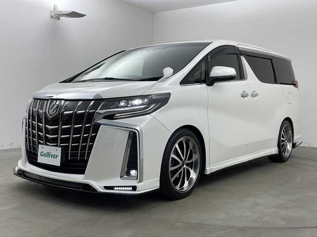 トヨタ アルファード S 兵庫県 2020(令2)年 3.3万km ホワイトパールクリスタルシャイン ・純正9インチナビ/・CD/DVD/AM/FM/・フルセグTV/・Bluetooth接続/・12.1インチフリップダウンモニター/・サンルーフ/・バックカメラ/・両側パワースライドドア/・ビルトインETC/・社外前後ドライブレコーダー/・HDMI接続/・2列目オットマン/・ZEUS製エアロ（フロント、サイド、リア）/・ZEUS製4本出しマフラー/・トヨタセーフティセンス/・プリクラッシュセーフティ/・レーンディパーチャーアラート/・クリアランスソナー/・パーキングサポートブレーキ/・ロードサインアシスト/・レーダークルーズコントロール/・オートマチックハイビーム/・社外フロアマット（M’Z SPEED）/・タナベローダウンサス/・電子パーキングブレーキ/・オートホールド/・
