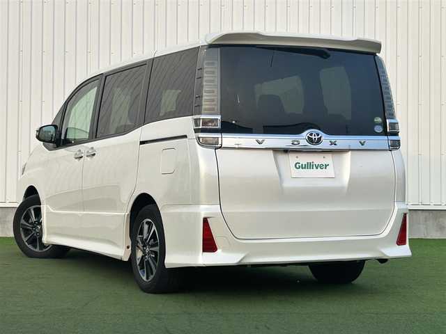 トヨタ ヴォクシー ZS 煌 香川県 2018(平30)年 3.8万km ホワイトパールクリスタルシャイン 社外8インチメモリーナビ/→AM/FM/CD/DVD/Bluetooth/フルセグTV/クルーズコントロール/衝突軽減ブレーキ/レーンキープアシスト/バックカメラ/ETC/アイドリングストップ/両側パワースライドドア/LEDヘッドライト/オートハイビーム/プッシュスタート/スマートキー/革巻きステアリング/ステアリングスイッチ