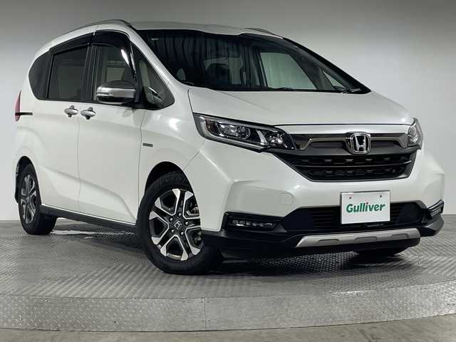 ホンダ フリード ハイブリット クロスター ホンダセンシング 神奈川県 2020(令2)年 4.1万km プラチナホワイトパール ホンダセンシング/純正9インチナビ/・BT/フルセグTV/SD/CD/DVD/AM/FM/バックカメラ/ハーフレザーシート/シートヒーター(D/N)/シートリフター/両側電動スライドドア/ビルトインETC/フロントデアイサー/革巻きステアリング/ステアリングスイッチ/Autoライト/フォグランプ/前後ドライブレコーダー/スマートキー/プッシュスタートボタン/電動格納ミラー/ウィンカーミラー/LEDヘッドライト/純正ドアバイザー/純正フロアマット/純正アルミホイール