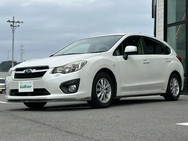 スバル インプレッサ スポーツ 1．6i－L 愛媛県 2012(平24)年 14.4万km サテンホワイトパール carrozzeria7型ナビ/黒革温電動シート/STiシフトノブ/STiフロントスポイラー/プッシュスタート/純正ラバーマット/ETC/横滑り防止装置/シガーソケット/ISOFIX/現状サマー(純正AW)(195/65/R15)/禁煙車