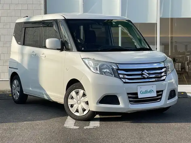 スズキ ソリオ G 宮崎県 2019(令1)年 10.3万km ピュアホワイトP 社外7インチナビ【AVIC-RZ502】/・ワンセグTV・Bluetooth・DVD・CD/バックカメラ/片側パワースライドドア/ETC/衝突軽減ブレーキ/レーダークルーズコントロール/オートライト/オートハイビームアシスト/後方コーナーセンサー/D席シートヒーター/純正ドアバイザー/プッシュスタート