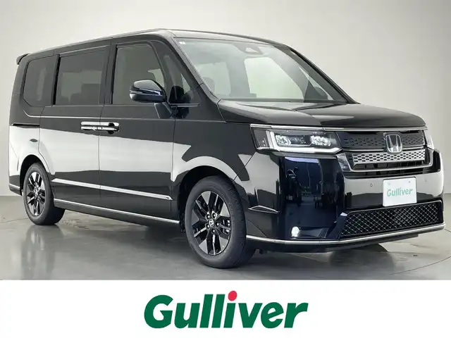 ホンダ ステップワゴン スパーダ eHEV 愛知県 2025(令7)年 0.1万km未満 クリスタルブラックパール 登録済未使用車/純正11.4型ナビ/フルセグTV/Blutooth/バックカメラ/後席モニター/両側パワースライドドア/パワーバックドア/BSM/ホンダセンシング/レーダークルーズコントロール/LEDヘッドライト/ハーフレザーシート/－－－－－－－－－－－－－－－－－/スパーダ　e:HEV　3CJ4AZ　11.4インチナビHonda CONNECTナビ LXM-247VFLi(317900円)