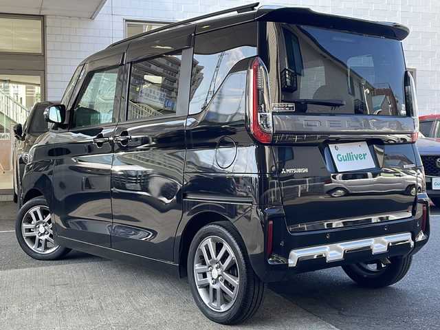 三菱 デリカミニ T プレミアム 京都府 2024(令6)年 1.8万km アメジストブラック SDナビ/（ケンウッド　MDV-D7098TW）/CD/DVD再生機能有/Bluetooth/マイパイロット/e-Assist/マルチアラウンドビューモニター/ステアリングヒーター/LEDヘッドライト/デジタルインナーミラー/ハーフレザーシート/両側自動スライドドア/禁煙車/シートヒーター/パドルシフト/キーレスオペレーション/プッシュスタート/ドライブレコーダー（前のみ）/　（DC-DR413）/ダウンヒルコントロール/フロアマット/ETC/レンタカー登録/保証書/取扱説明書